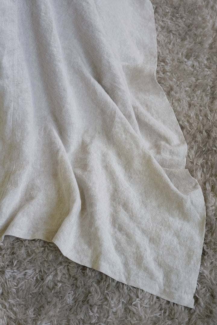 Close-up of premium Natural linen fabric texture, OEKO-TEX certified and sustainably sourced European flax.